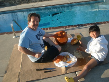 Kasen and Daddy carving the pumpkin